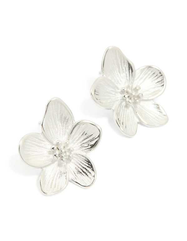 Crafted from stainless steel, these mini textured flower earrings feature waterproof floral design in silver front view