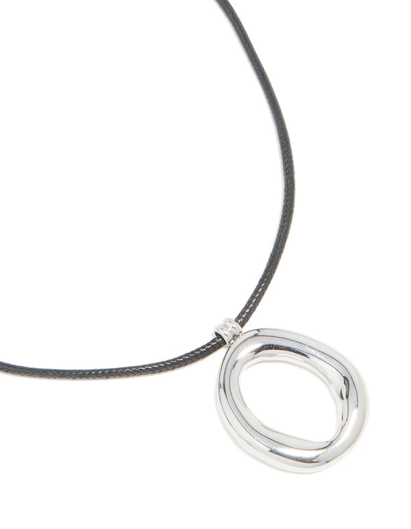 Featuring a waterproof organic pendant necklace crafted from stainless steel on a black cord close up view