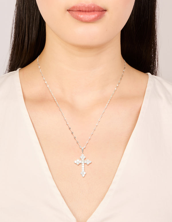 Showcasing a cross necklace in waterproof stainless steel with cubic zirconia and statement style on neck view