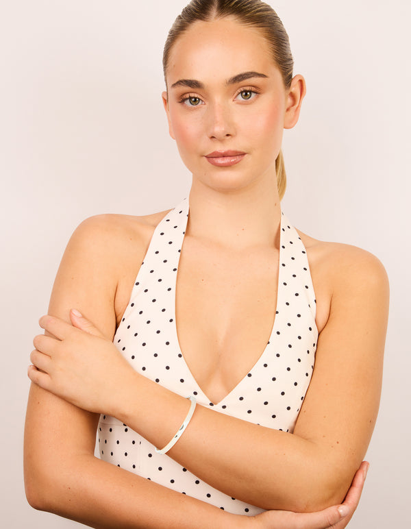 Highlighting a waterproof stainless steel hammered hinged bangle in silver with statement appeal on model view
