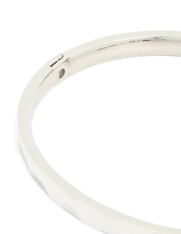 Crafted from waterproof stainless steel with hammered hinged mechanism in silver and statement aesthetic closure detail view