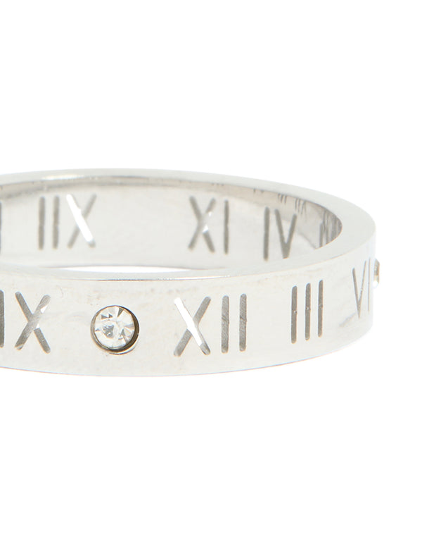 Highlighting waterproof stainless steel construction with engraved Roman numerals and cubic zirconia stones in silver and clear stone close up view