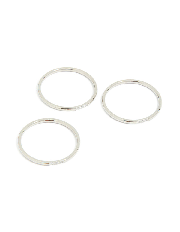 Crafted from waterproof stainless steel, this thin cubic zirconia trio rings 3-pack in silver and clear stone front view