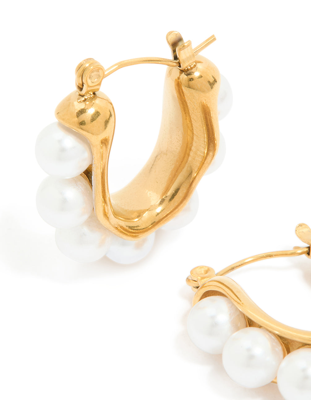 Designed with waterproof gold plated stainless steel featuring pearl puffy hoop earrings close up view