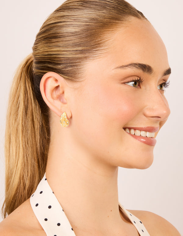 Crafted from waterproof gold plated stainless steel diamante teardrop bubble earrings styled on model view