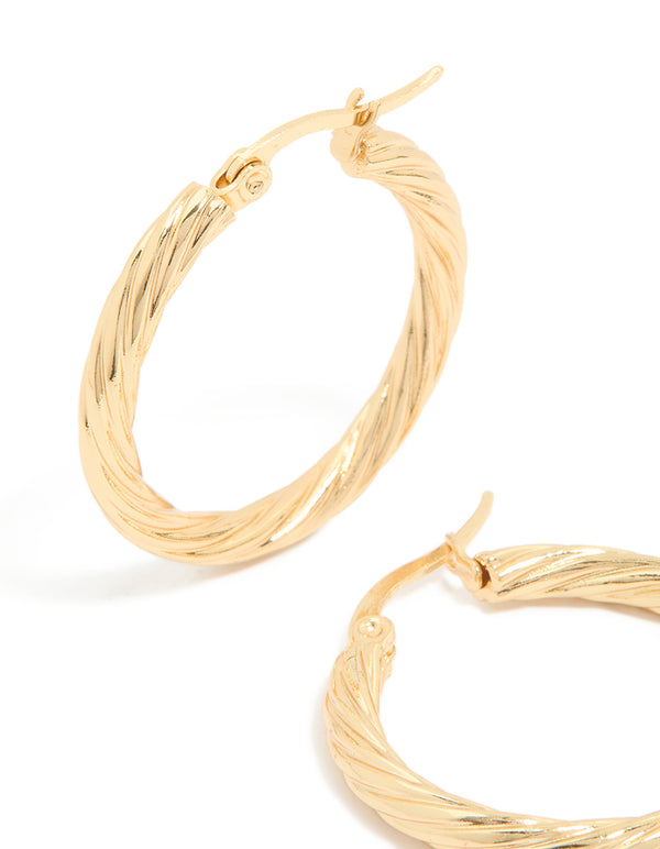 Designed with waterproof gold plated stainless steel large twisted hoop earrings featuring statement style close up view