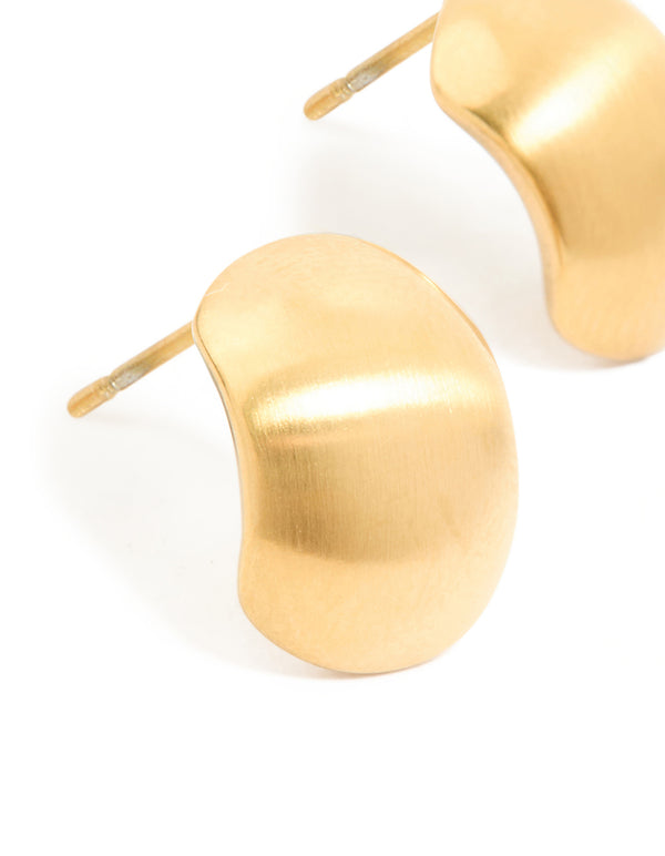 Crafted from waterproof gold plated stainless steel brushed pebble earrings highlighting curved shape and texture in close up view