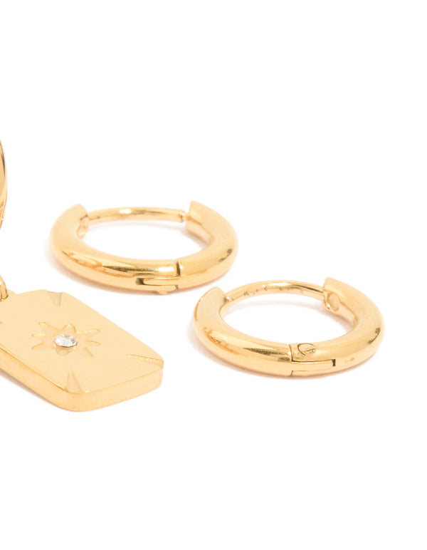 Highlighting waterproof gold plated stainless steel cubic zirconia star disc and huggie earrings in a 3-pack with celestial accents post detail view