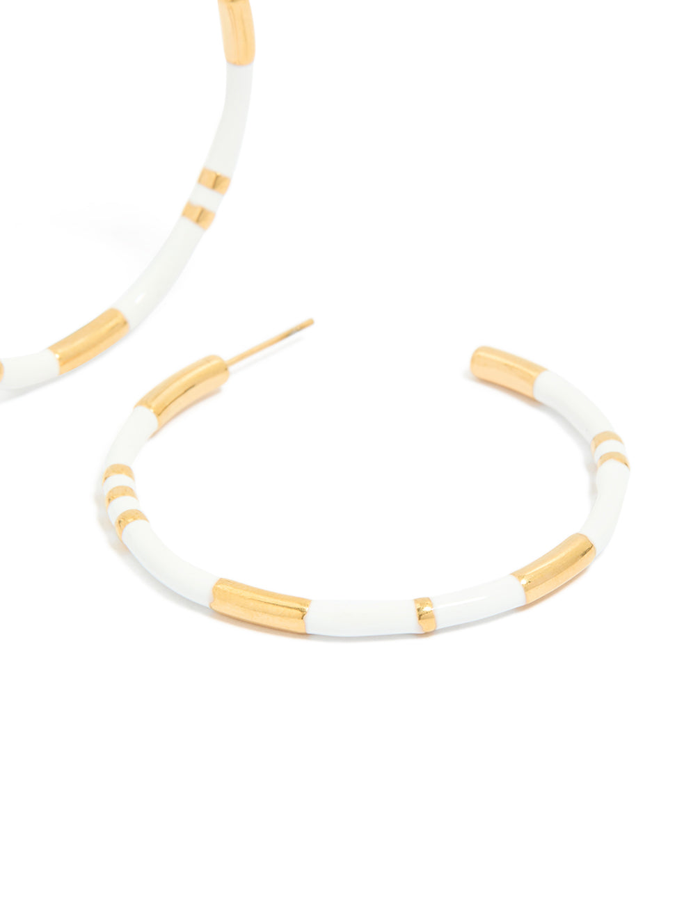 Highlighting waterproof statement hoop earrings in white enamel and gold plated stainless steel post detail view