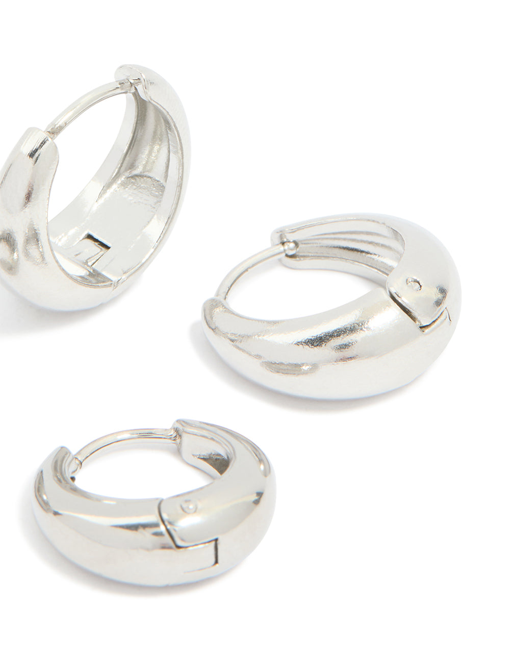 Presenting chunky waterproof stainless steel oval huggie earrings in silver, 2-pack post detail view