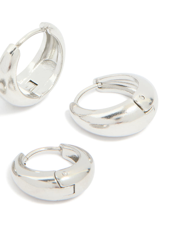 Presenting chunky waterproof stainless steel oval huggie earrings in silver, 2-pack post detail view