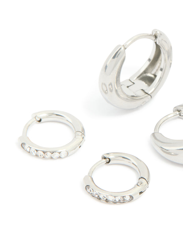 Capturing waterproof stainless steel cubic zirconia mix huggie earrings 3-pack with silver finish and clear tones close up view