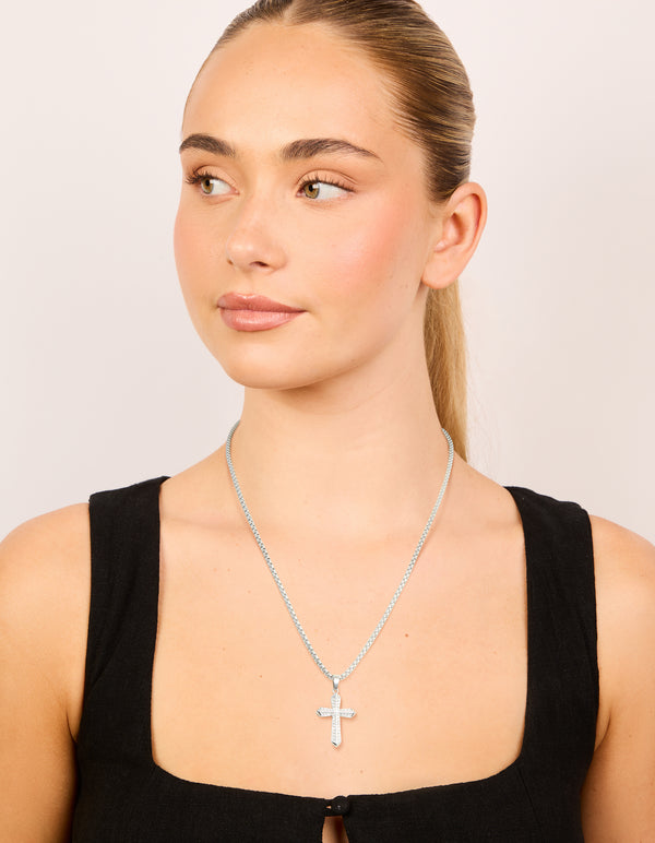 Featuring waterproof stainless steel pavé cubic zirconia cross necklace designed in silver on model view