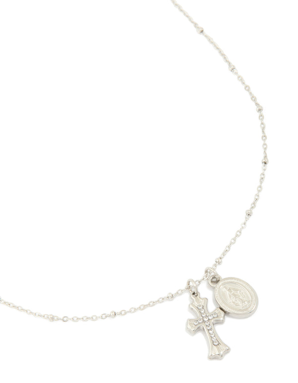 Showcasing a waterproof stainless steel necklace with mary charm, cross and balls in silver featuring statement styling close up view