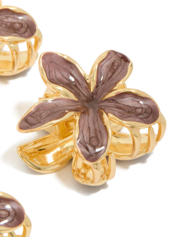 Designed with small brown frangipani flower claw clips in gold side view