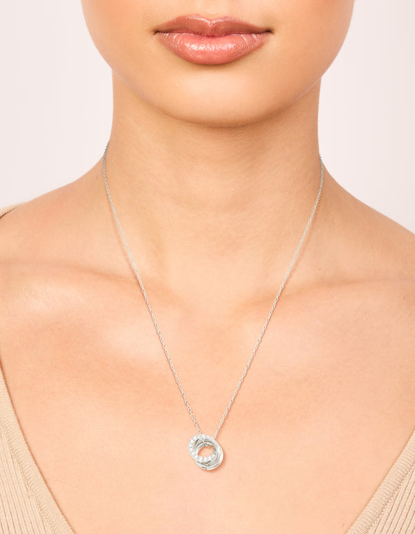 Showcasing a waterproof stainless steel cubic zirconia triple circle link necklace in silver on neck view