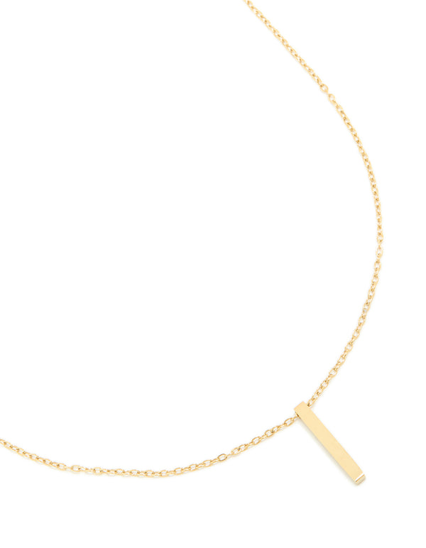 Featuring a waterproof bar pendant necklace in stainless steel with engravable pillar design and gold plated finish close up view