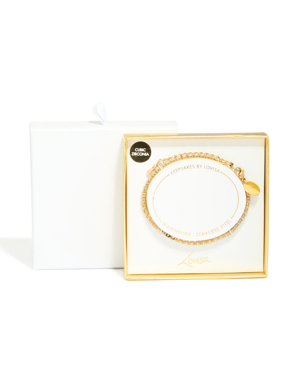 Presenting a waterproof stainless steel tennis bracelet, crafted from gold plated material featuring clear cubic zirconia closure detail view