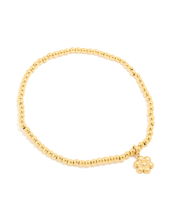 Crafted from waterproof gold plated stainless steel, this stretch bracelet features beads and flower in gold front view