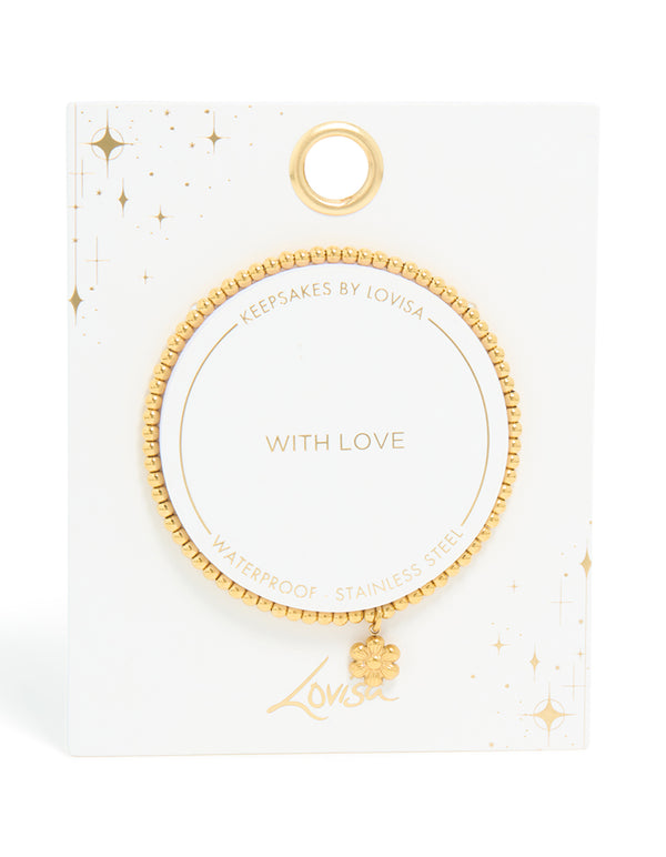 Crafted from waterproof gold plated stainless steel, this stretch bracelet features beads and flower in gold front view