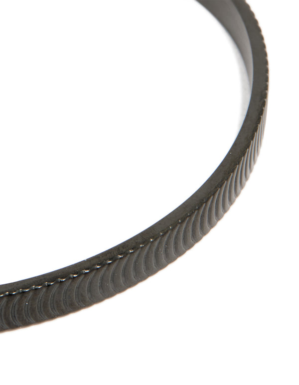 Highlighting a mens waterproof black stainless steel detailed wrist cuff close up view