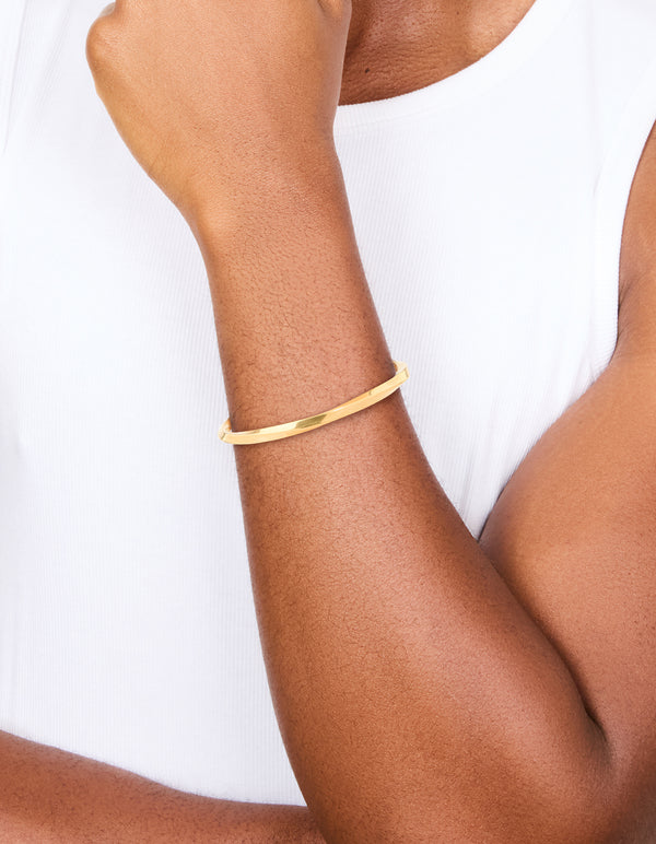 Discover this waterproof gold plated stainless steel square twist wrist cuff on wrist view