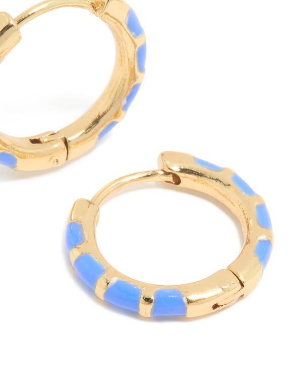 Featuring waterproof statement huggie earrings crafted from stainless steel with bamboo design and blue enamel in a gold plated finish post detail view