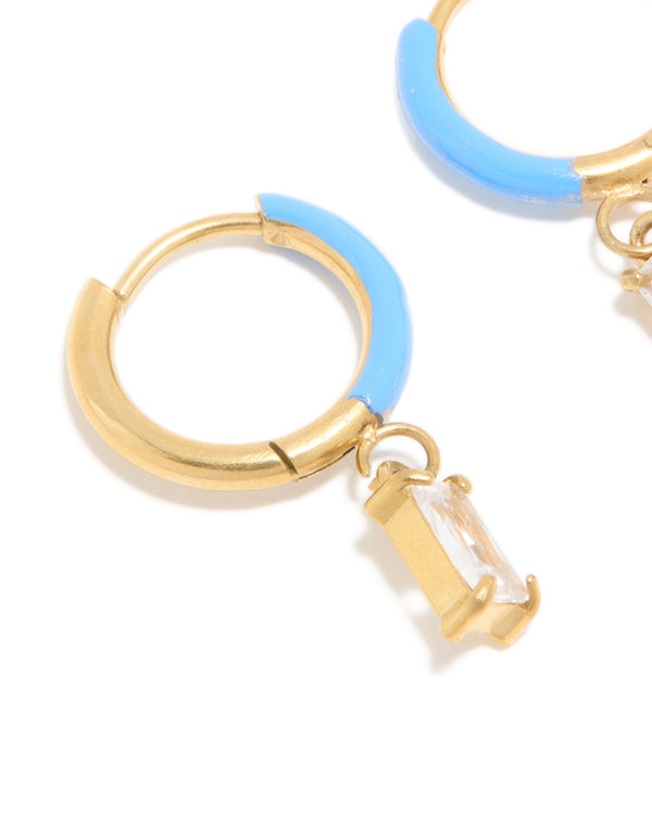 Crafted from waterproof gold plated stainless steel with light blue enamel and crystal charm huggie earrings close up view