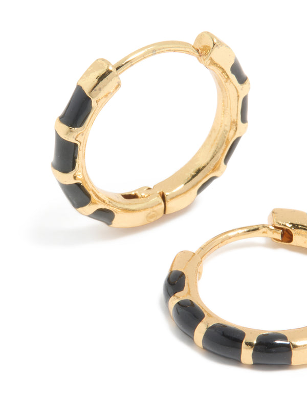 Detailed view of waterproof gold plated stainless steel black enamel bamboo huggie earrings highlighting segmented design close up view