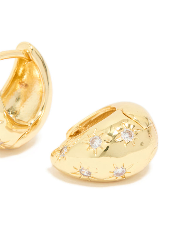 Presenting statement celestial huggie earrings crafted from gold plated cubic zirconia post detail view