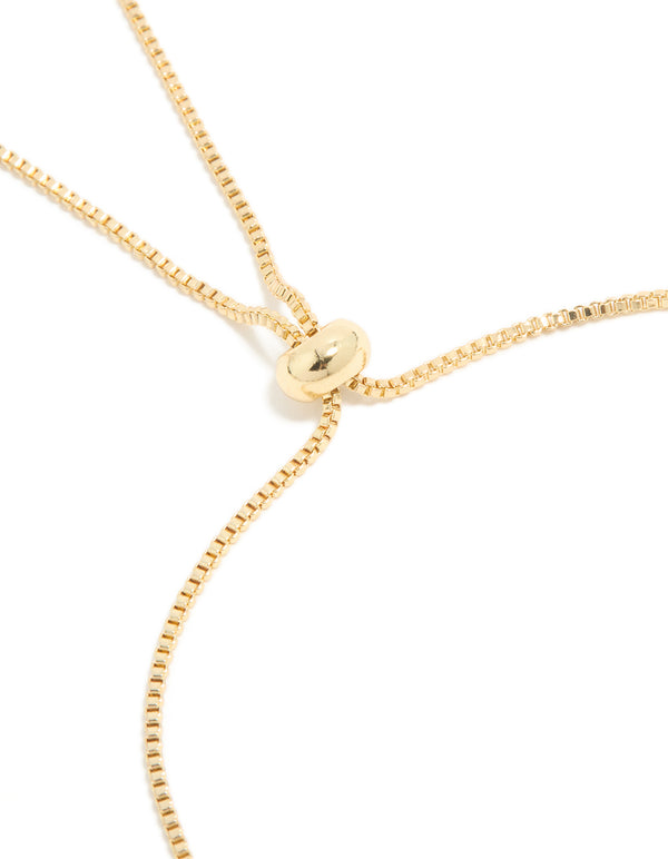 Refined gold plated cubic zirconia stars toggle bracelet featuring celestial design closure detail view