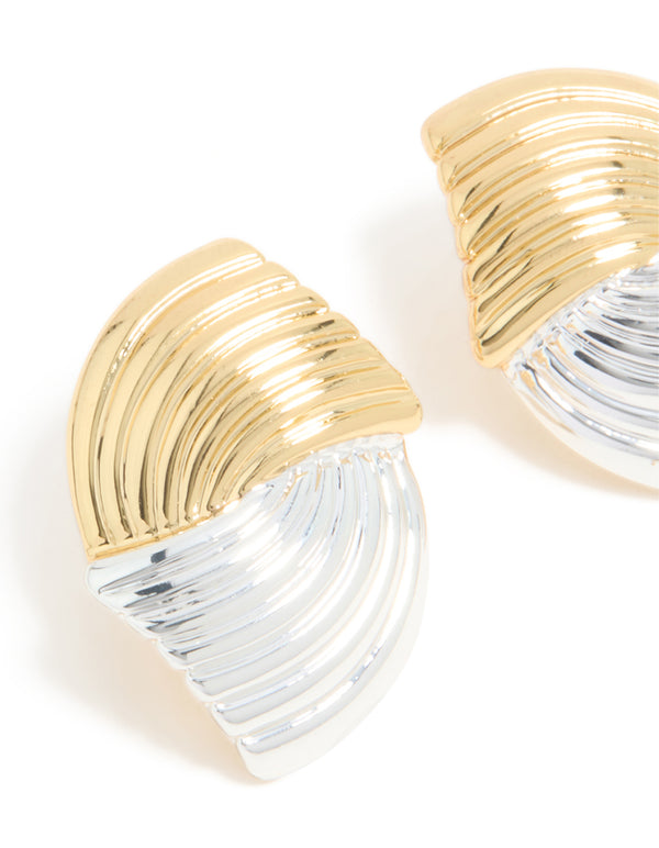 Displaying mixed metal plated wavy ribbed stud earrings with gold and silver close up view