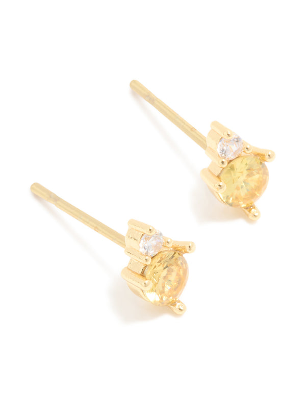 Introducing waterproof stainless steel November cubic zirconia duo stud earrings crafted in gold with yellow and clear stones front view