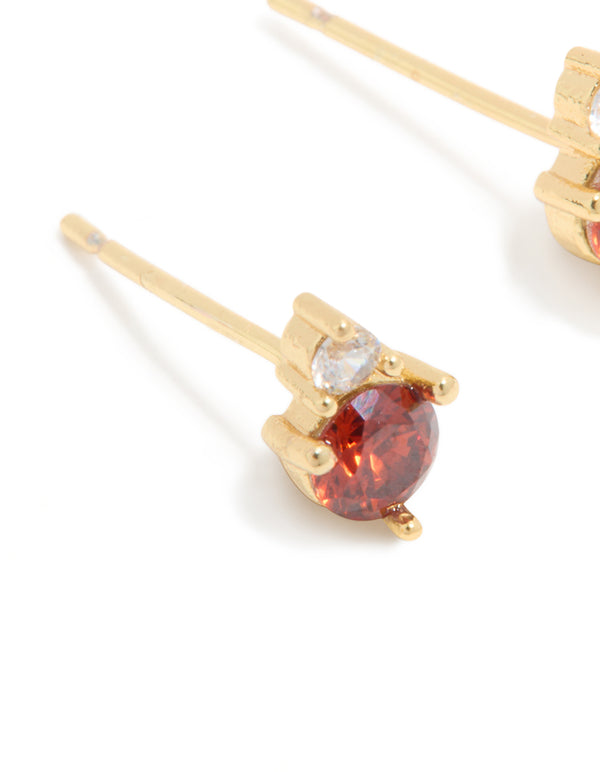 Designed with dainty waterproof stainless steel duo stud earrings featuring gold plated finish and cubic zirconia stones close up view