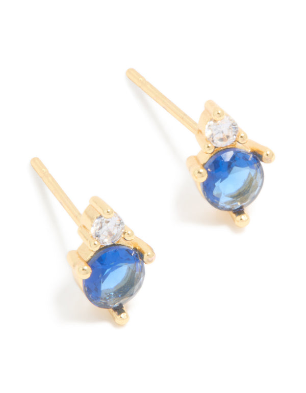 Showcasing waterproof stainless steel duo September birthstone stud earrings featuring cubic zirconia in royal blue and clear with gold plated finish front view