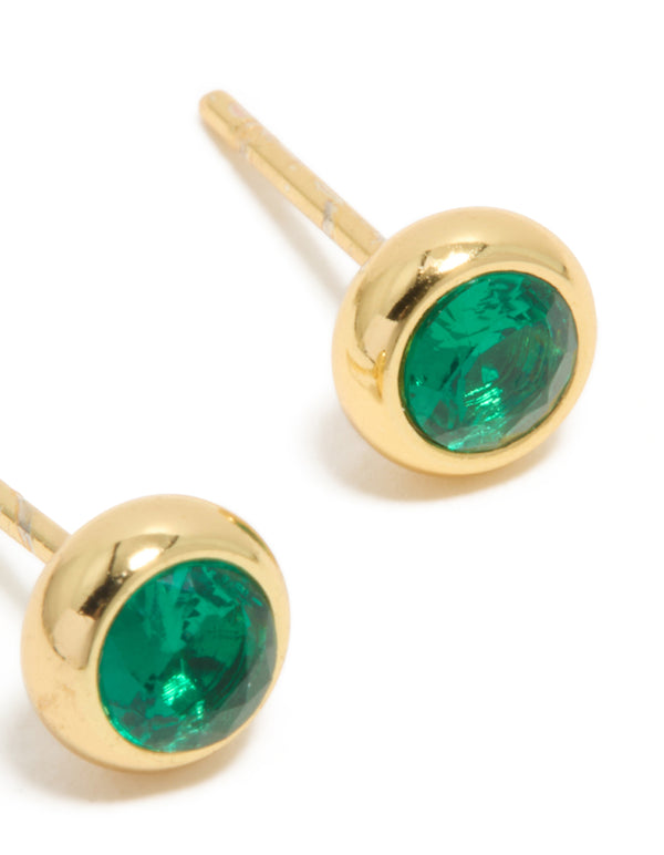 Crafted from dainty waterproof stainless steel bezel stud earrings with emerald round cut cubic zirconia in gold plated teal post detail view