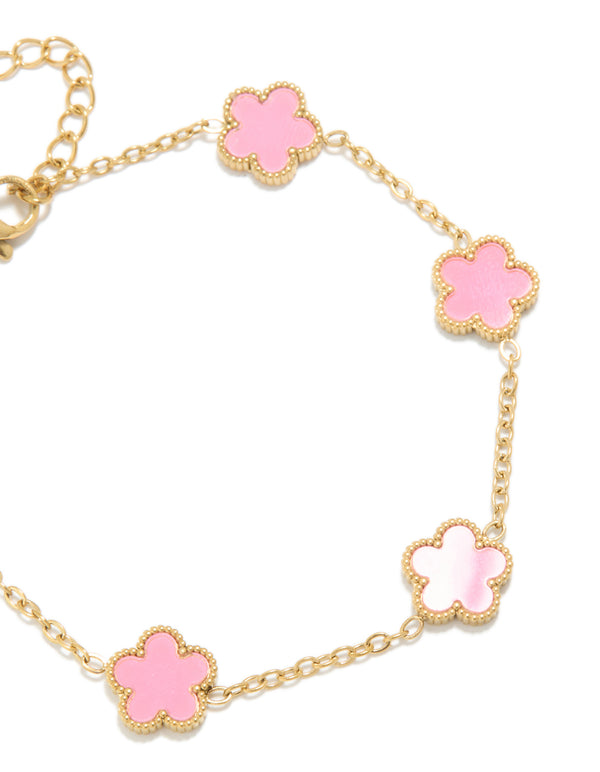 This waterproof gold plated stainless steel charm bracelet features light pink petal flowers in dainty design close up view
