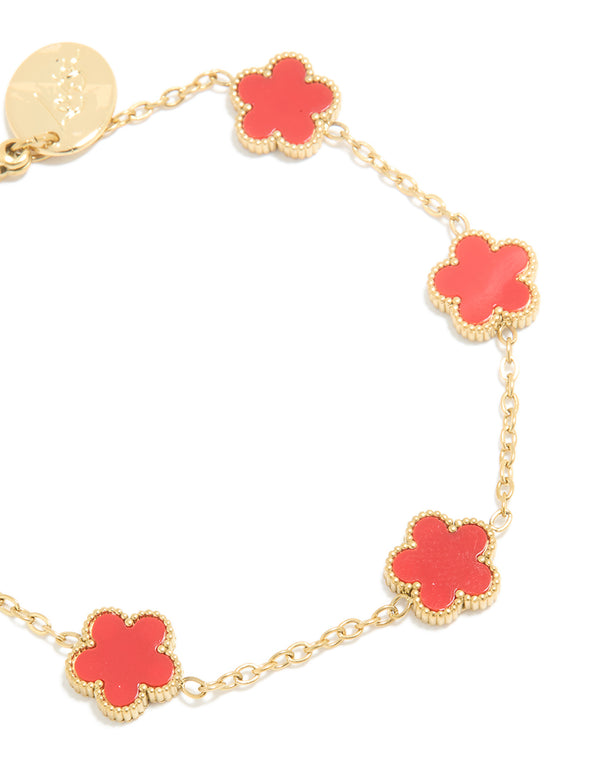 Designed with waterproof stainless steel in gold plated finish, this red shell floral petal charm bracelet close up view