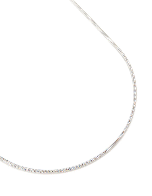 Featuring a waterproof stainless steel short snake chain necklace in silver close up view
