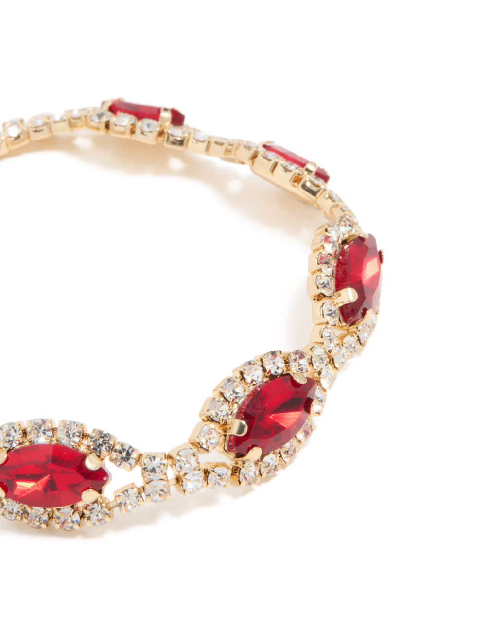 Detailed view of gold bracelet highlighting red pear shape diamante stones and clear crystal halos close up view