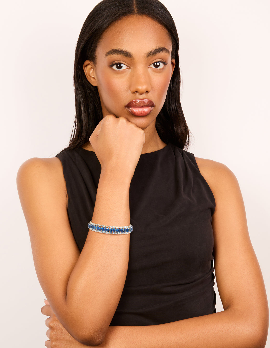 This silver mini blue diamantes wrist cuff bangle is styled on model view