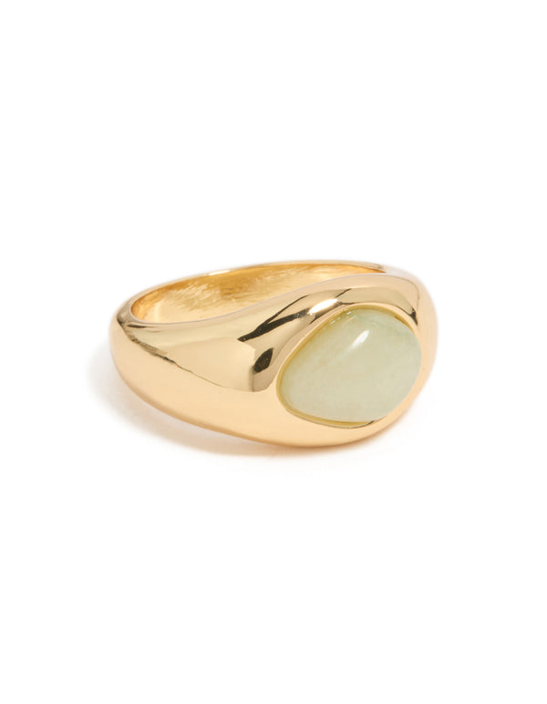 Showcasing a gold plated ring with pale green oval stone in a statement style front view