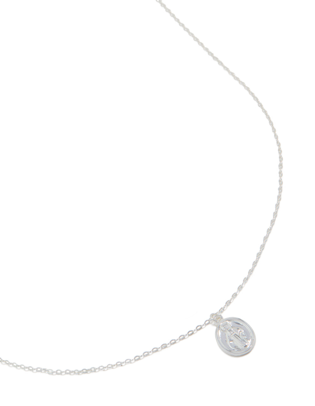 Beautifully crafted sterling silver round Mary pendant necklace with statement styling in silver close up view