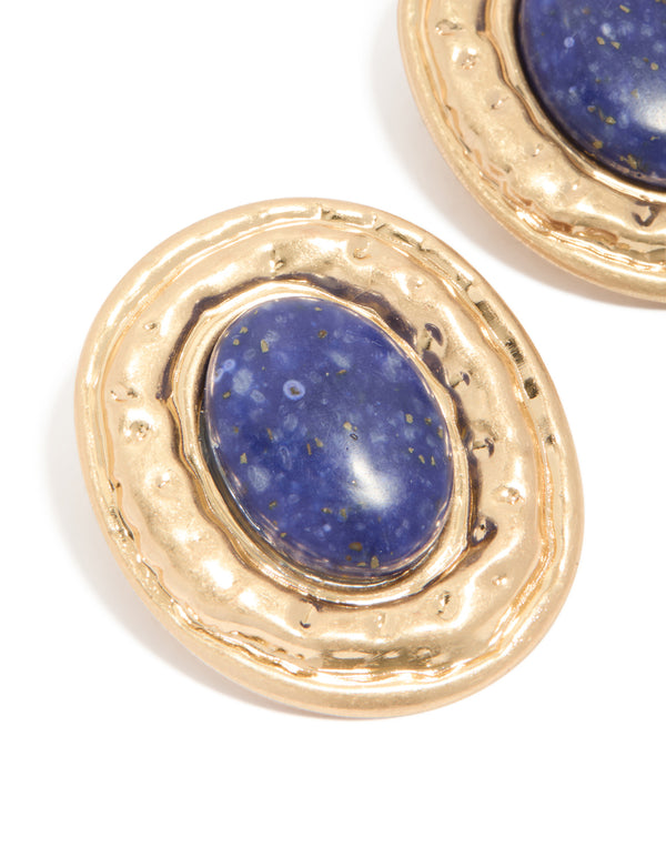 Designed with worn gold round hammered dark blue acrylic stud earrings featuring statement style close up view