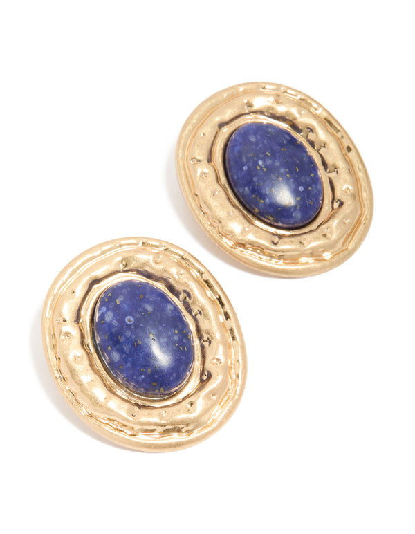 Showcasing worn gold round hammered dark blue acrylic stud earrings with statement style and stud closure front view