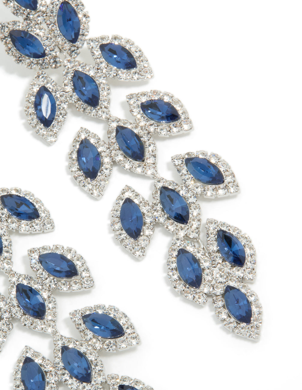 Beautifully designed statement drop earrings with royal blue diamantes in pear cut crafted from silver close up view