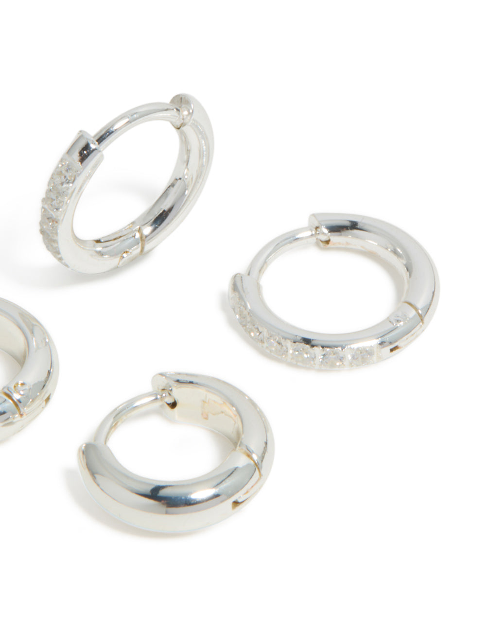 Sophisticated waterproof stainless steel pave and plain huggie earrings in a 2-pack featuring cubic zirconia hoop closure, captured in silver post detail view