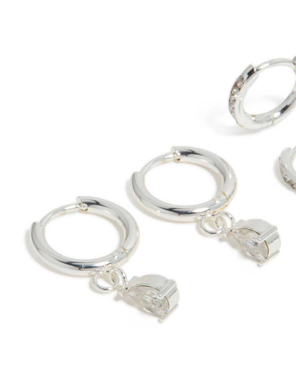Featuring waterproof stainless steel cubic zirconia pear and huggie earrings in a 2-pack in silver close up view
