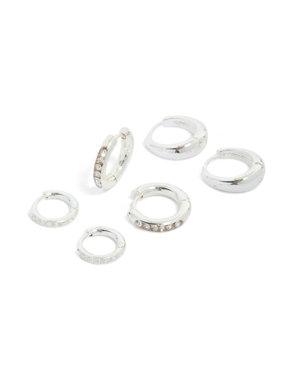 Discover waterproof stainless steel basic, pavé and plain huggie earrings featuring cubic zirconia in a silver 3-pack front view