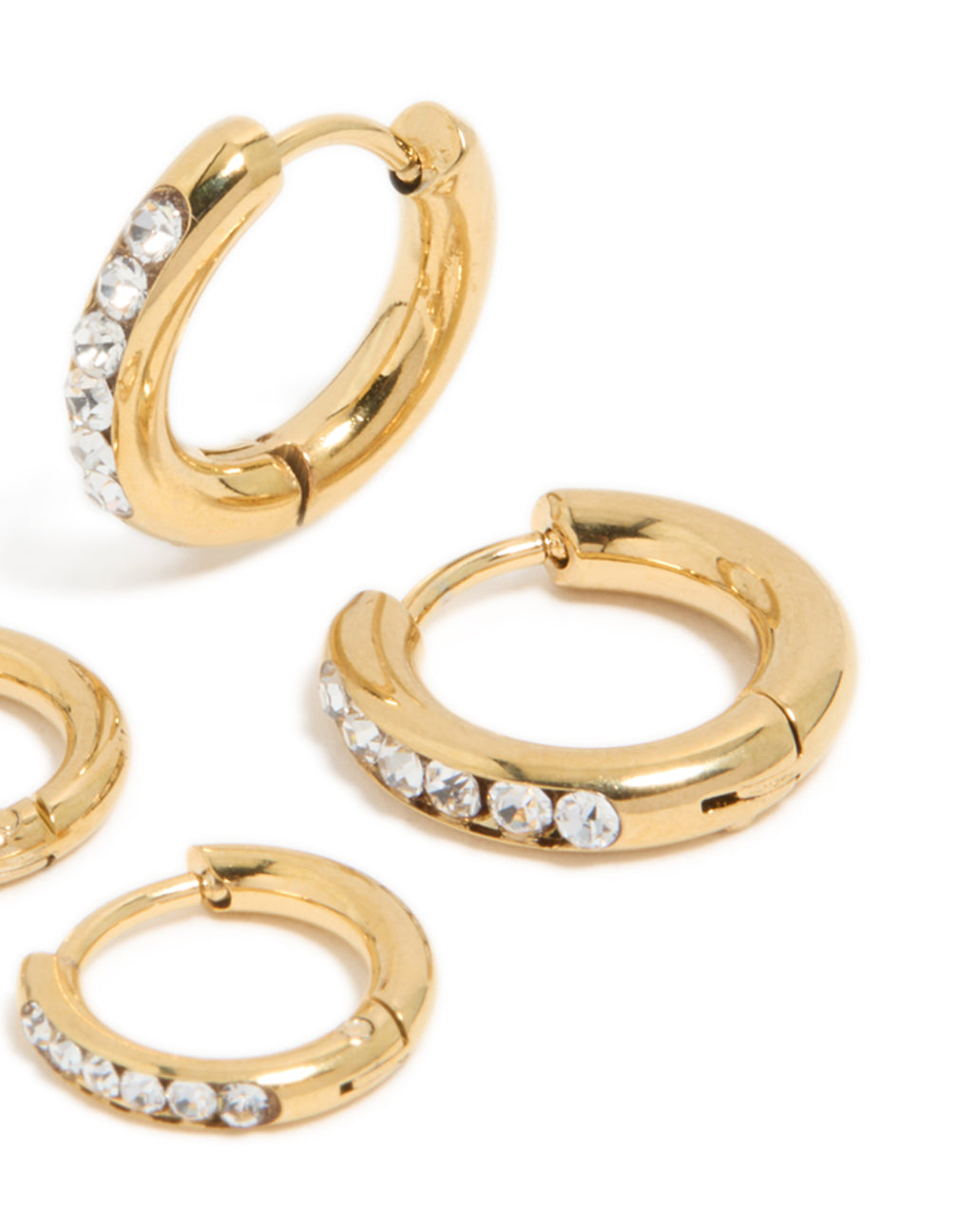 Displaying waterproof gold plated stainless steel cubic zirconia huggie earrings in a 2-pack with crystal and hoop closure post detail view